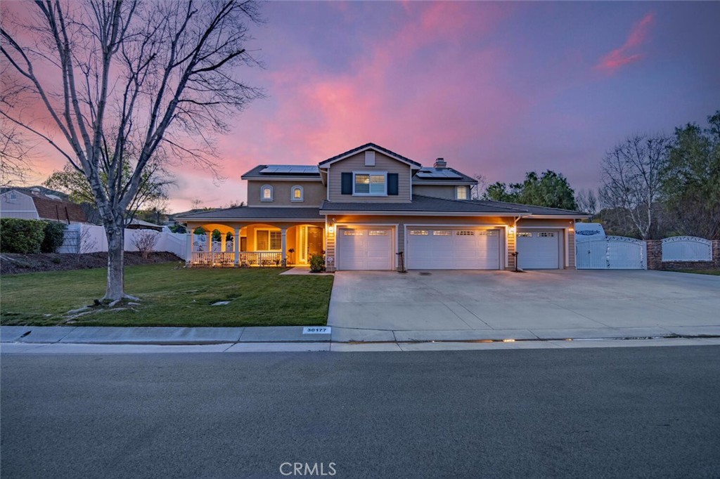 30177 Sagecrest Way Castaic, CA 91384 - Photo 46 of 54 a front view of a house with a yard and garage
