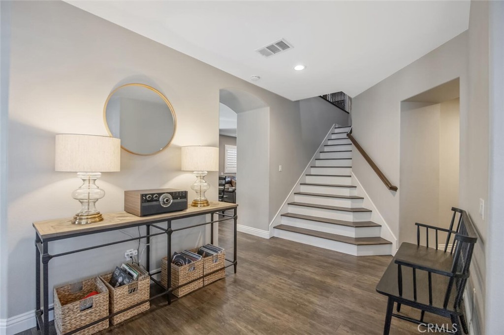 30177 Sagecrest Way Castaic, CA 91384 - Photo 10 of 54 a view of a hallway with wooden floor and entryway