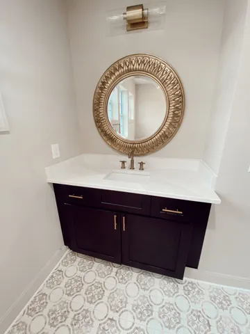 a room with a sink and a mirror