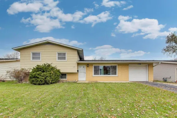 a front view of house with yard
