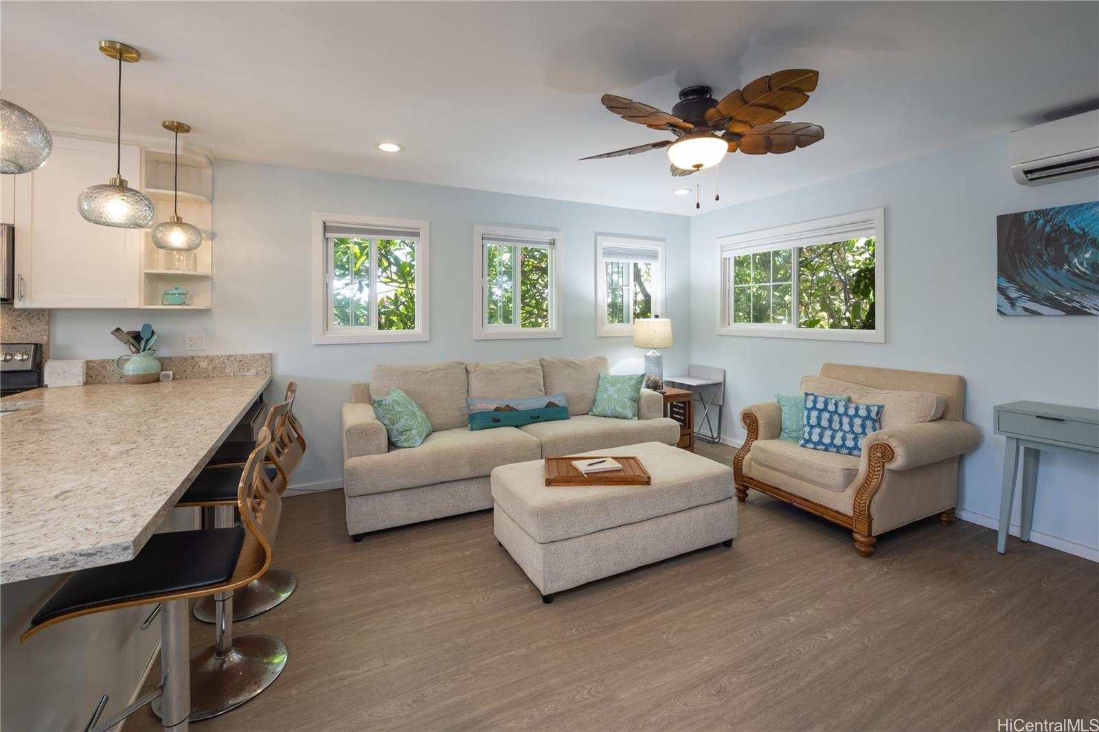 409 Wanaao Road Kailua, HI 96734 - Photo 19 of 25 a living room with furniture ceiling fan and a window