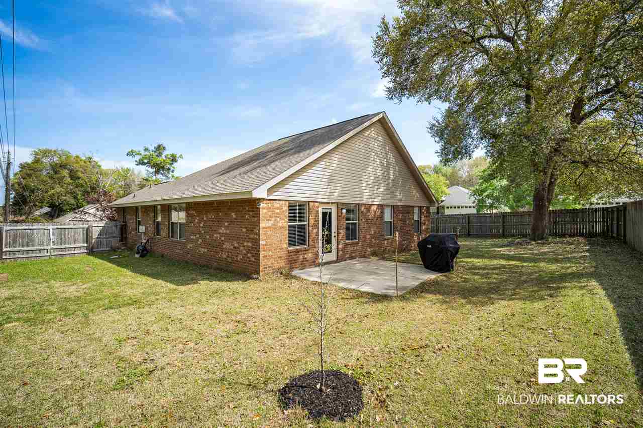 8075 Brookside Lane Daphne, AL 36526 - Photo 21 of 26 Backyard w/ Almond Tree