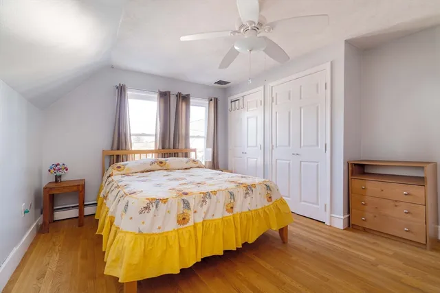 a bedroom with a bed and a dresser