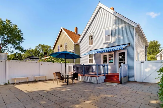 a view of house with outside seating area