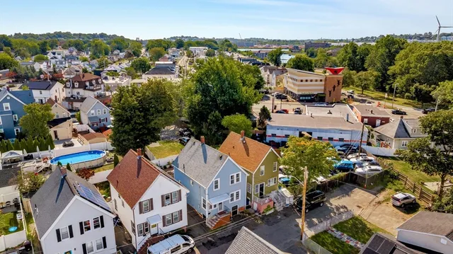 an aerial view of residential houses with outdoor space
