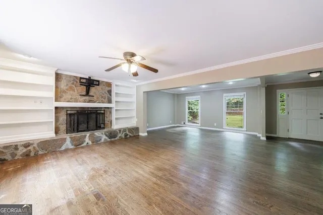a view of entryway with wooden floor and stairs
