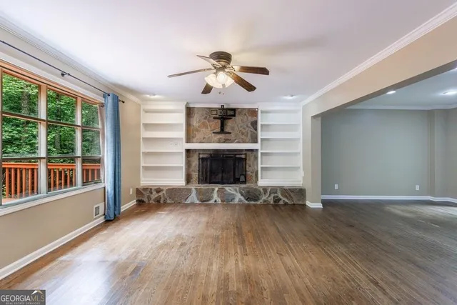 a bathroom with a granite countertop sink toilet and mirror