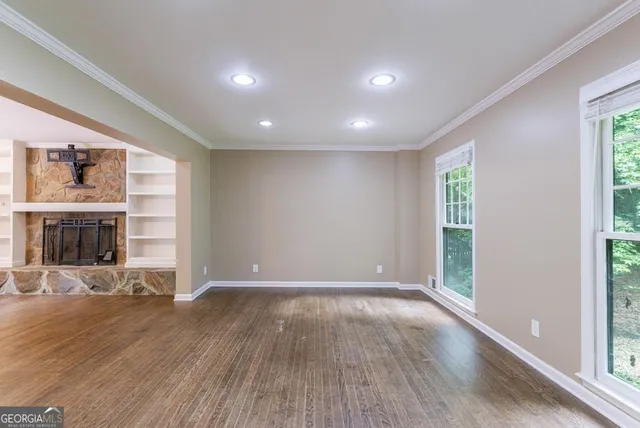 a view of kitchen with wooden floor and window