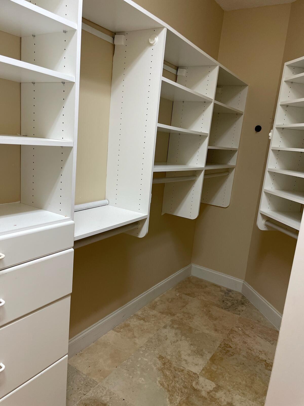 6675 Northwest 25th Way Boca Raton, FL 33496 - Photo 14 of 54 a view of an empty walk in closet