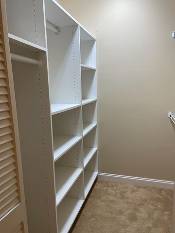 a view of an empty walk in closet