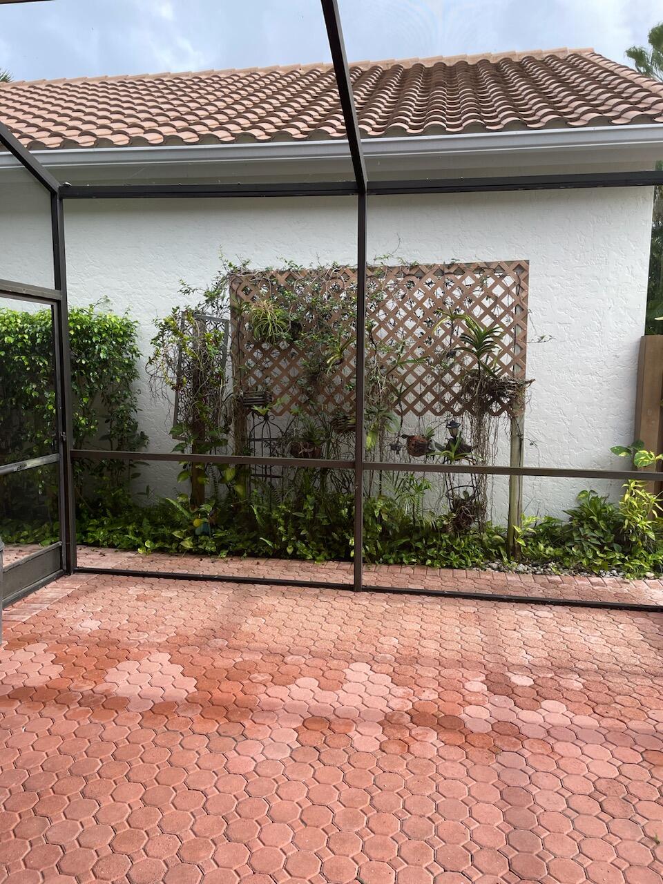 6675 Northwest 25th Way Boca Raton, FL 33496 - Photo 23 of 54 a view of a bench in a patio