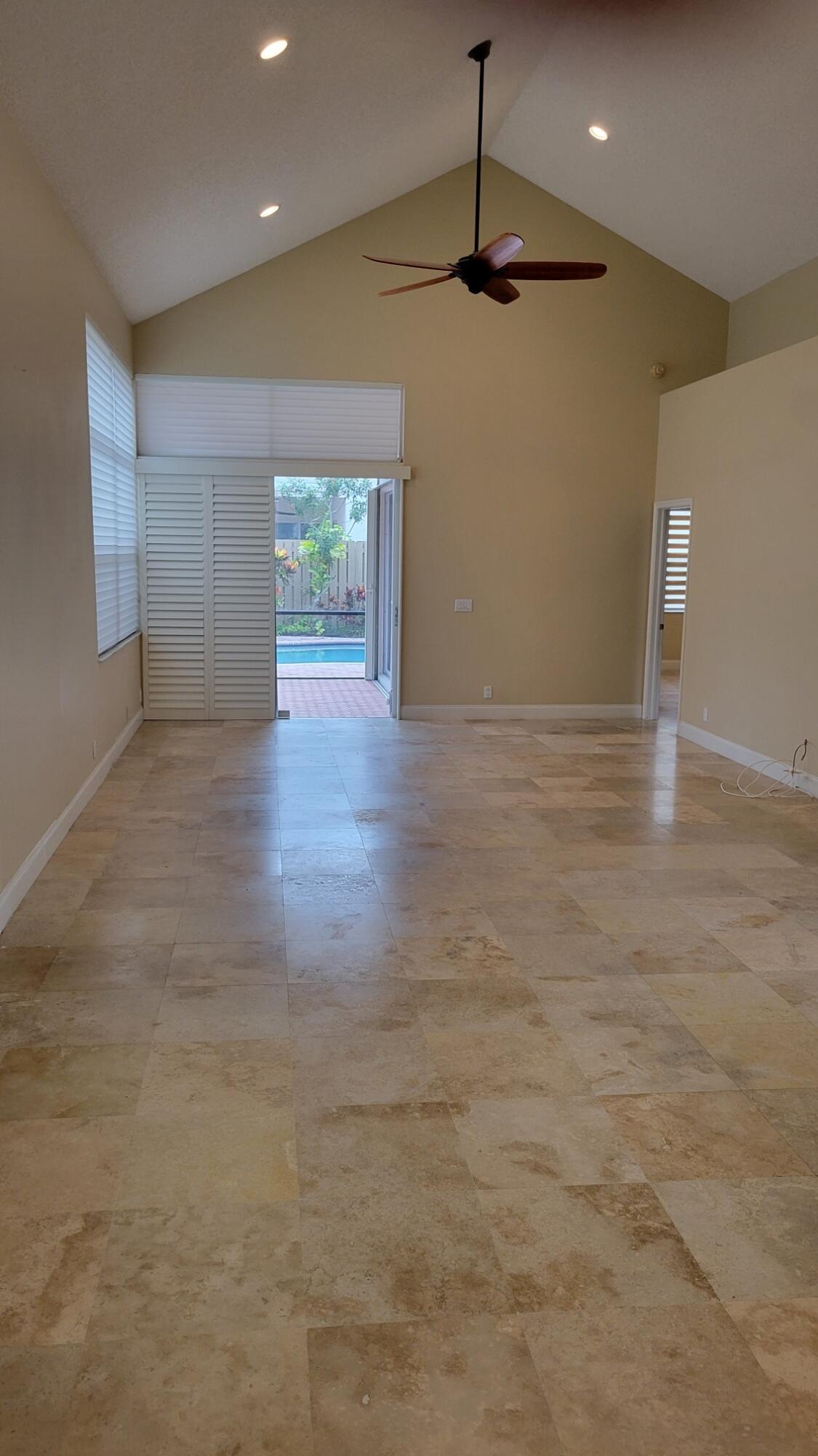 6675 Northwest 25th Way Boca Raton, FL 33496 - Photo 28 of 54 a view of a livingroom with a ceiling fan and window