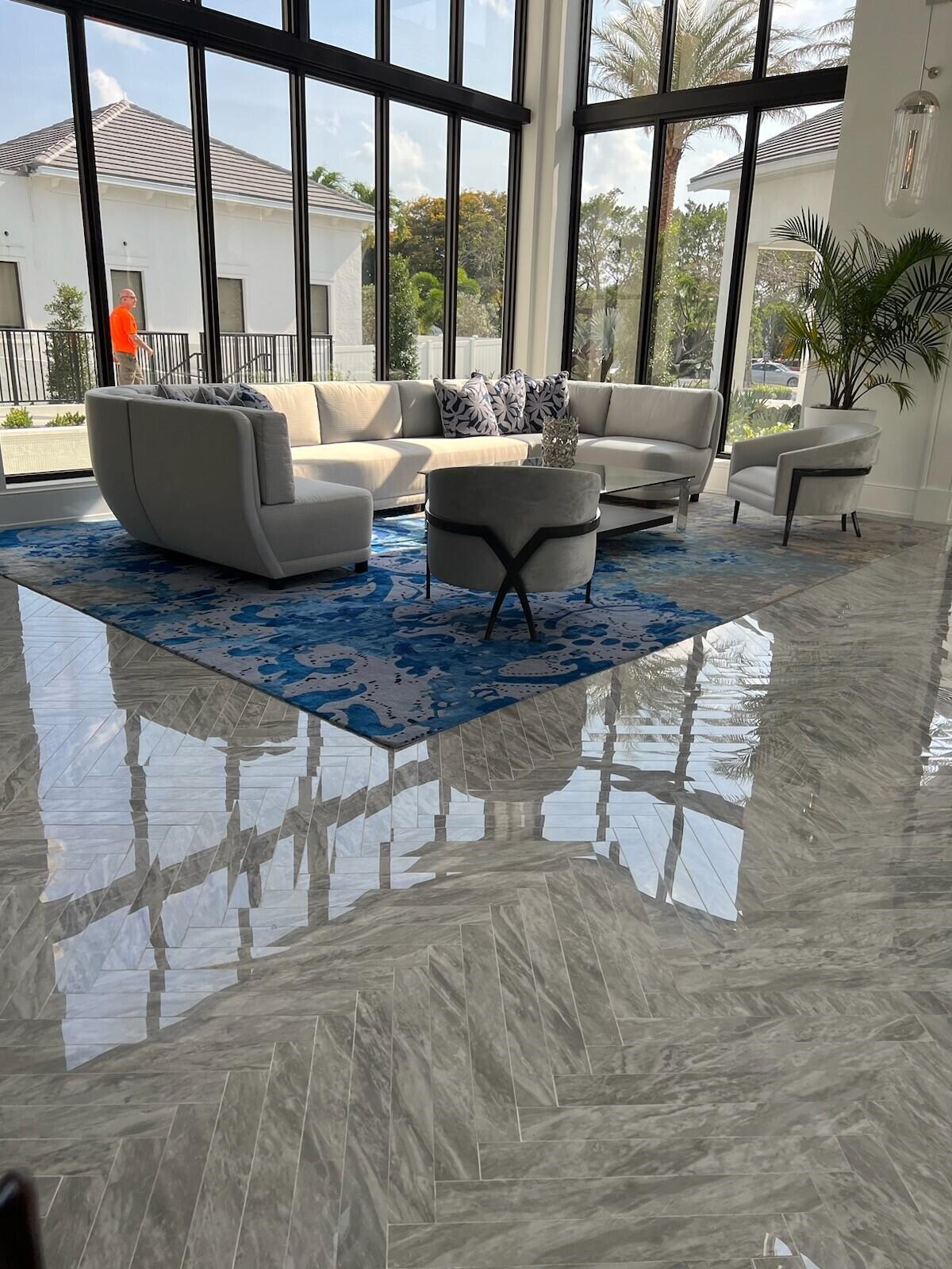 6675 Northwest 25th Way Boca Raton, FL 33496 - Photo 35 of 54 a living room with furniture and a floor to ceiling window