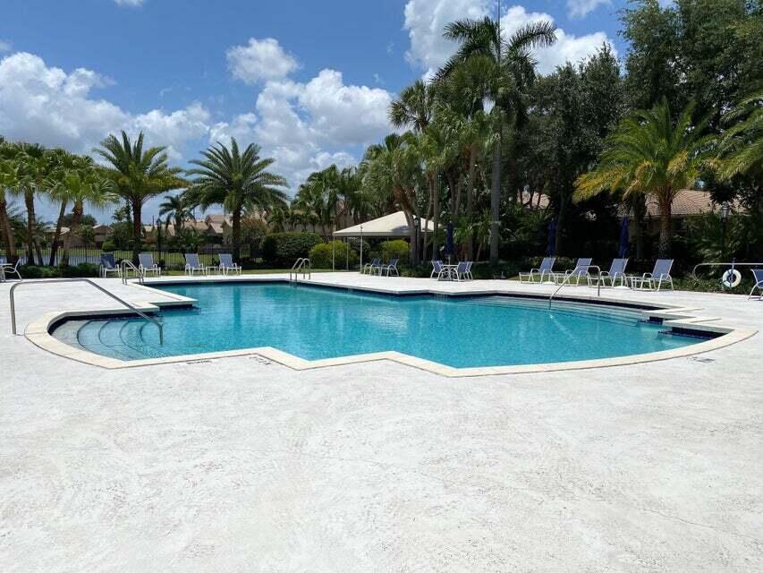 6675 Northwest 25th Way Boca Raton, FL 33496 - Photo 46 of 54 a view of a swimming pool with a patio