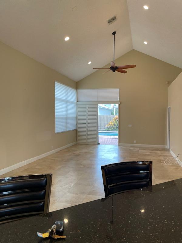 6675 Northwest 25th Way Boca Raton, FL 33496 - Photo 10 of 54 a room with wooden floor and windows