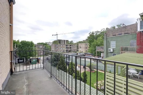 a view of a balcony with city view