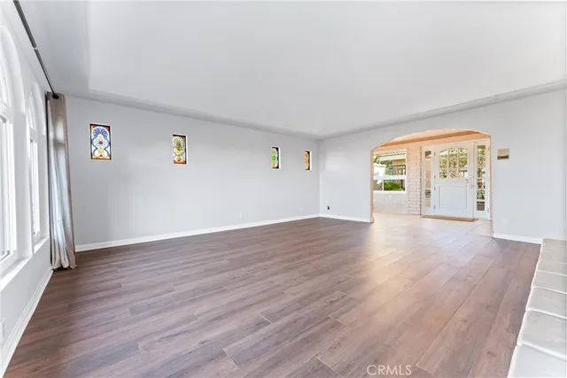 a kitchen with stainless steel appliances kitchen island granite countertop a refrigerator and a stove top oven