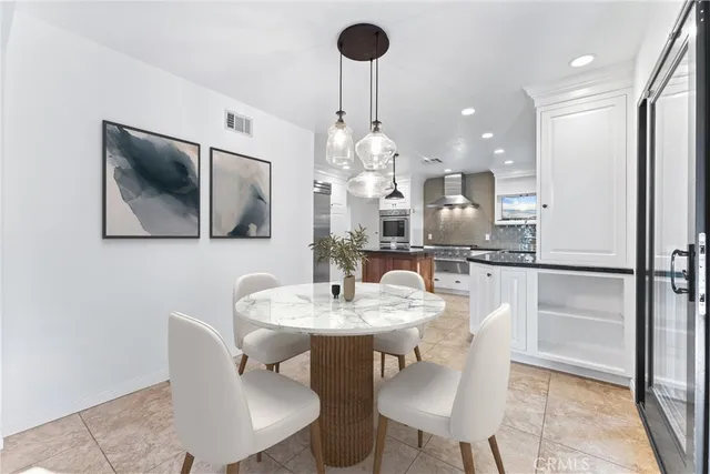 a bedroom with a bed window and a flat screen tv
