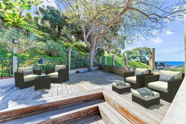 a view of an entryway with a lot of flower plants