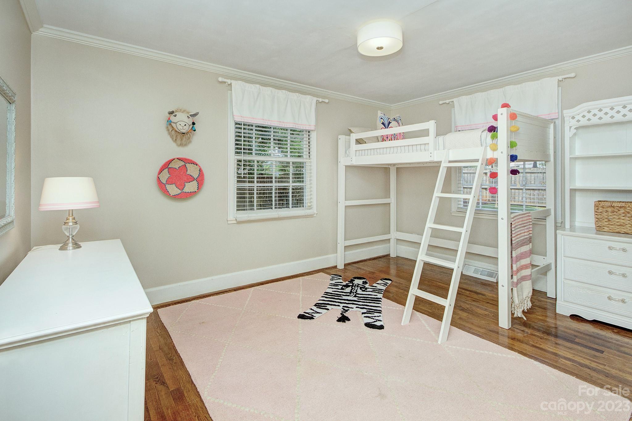 1000 Sedgefield Road Charlotte, NC 28209 - Photo 19 of 29 a room with furniture a chandelier and a window