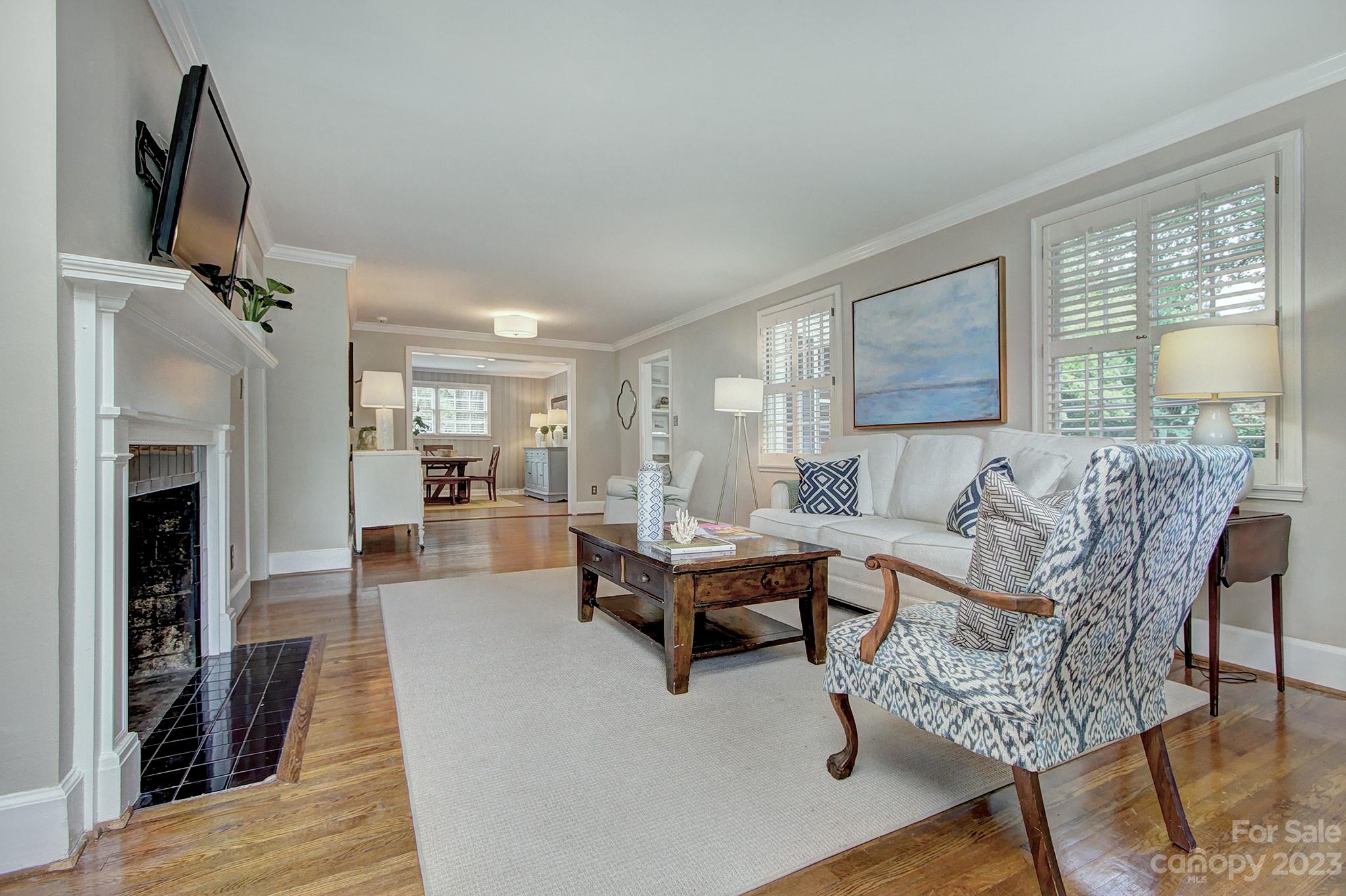 1000 Sedgefield Road Charlotte, NC 28209 - Photo 5 of 29 a living room with furniture and a fireplace