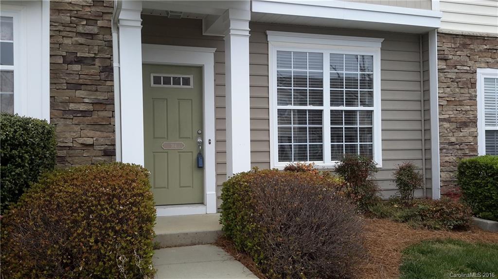 311 Sugar Ridge Court, Unit 109 Fort Mill, SC 29708 - Photo 1 of 23 a front view of a house with a yard