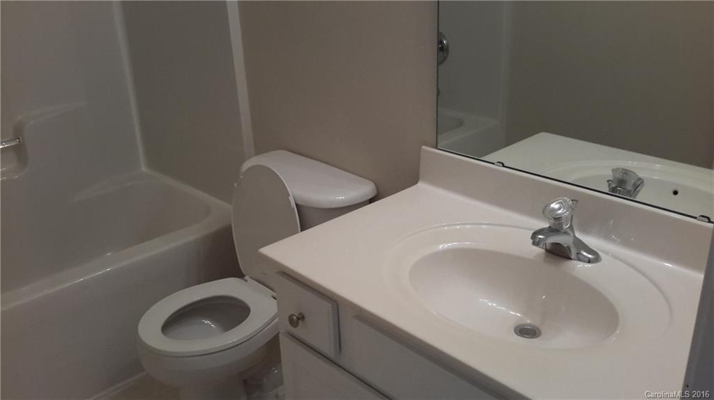 311 Sugar Ridge Court, Unit 109 Fort Mill, SC 29708 - Photo 14 of 23 a bathroom with a sink and a toilet