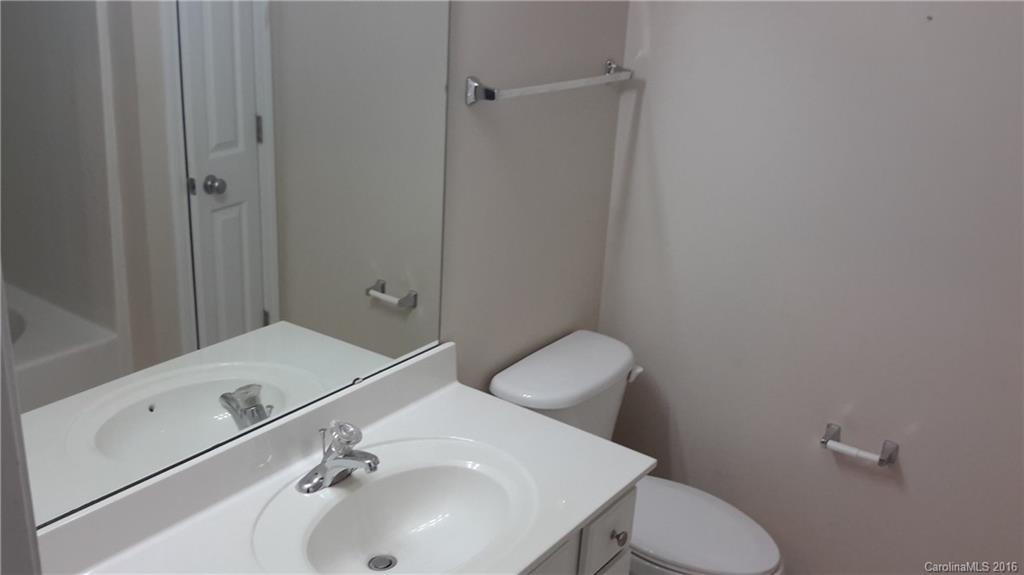 311 Sugar Ridge Court, Unit 109 Fort Mill, SC 29708 - Photo 15 of 23 a bathroom with a sink toilet and vanity