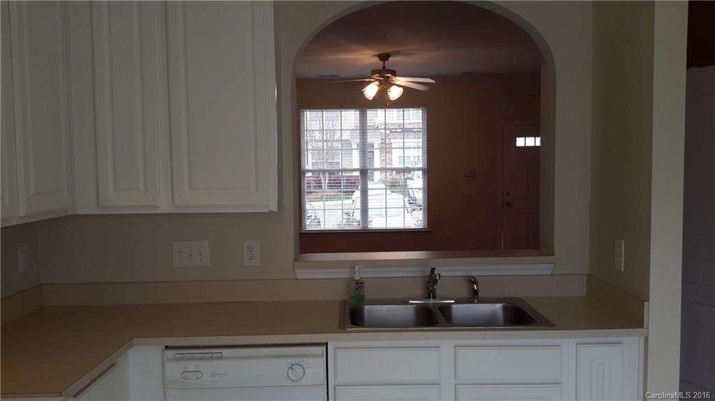 311 Sugar Ridge Court, Unit 109 Fort Mill, SC 29708 - Photo 9 of 23 a kitchen with a sink and cabinets