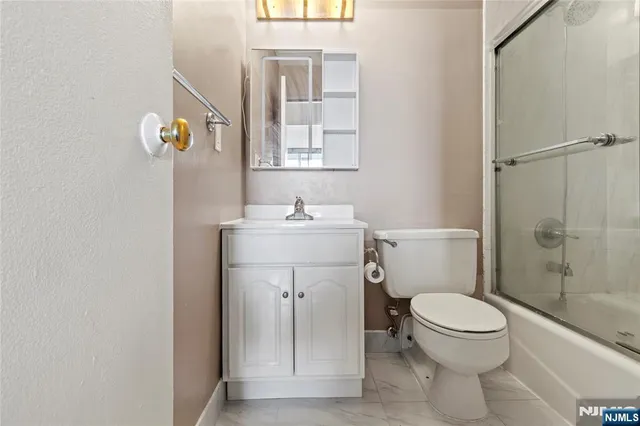 a dining room with furniture and a window