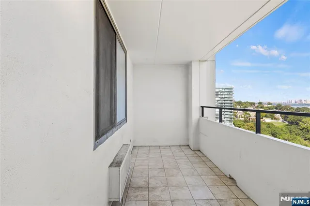 a view of roof deck with island and city view