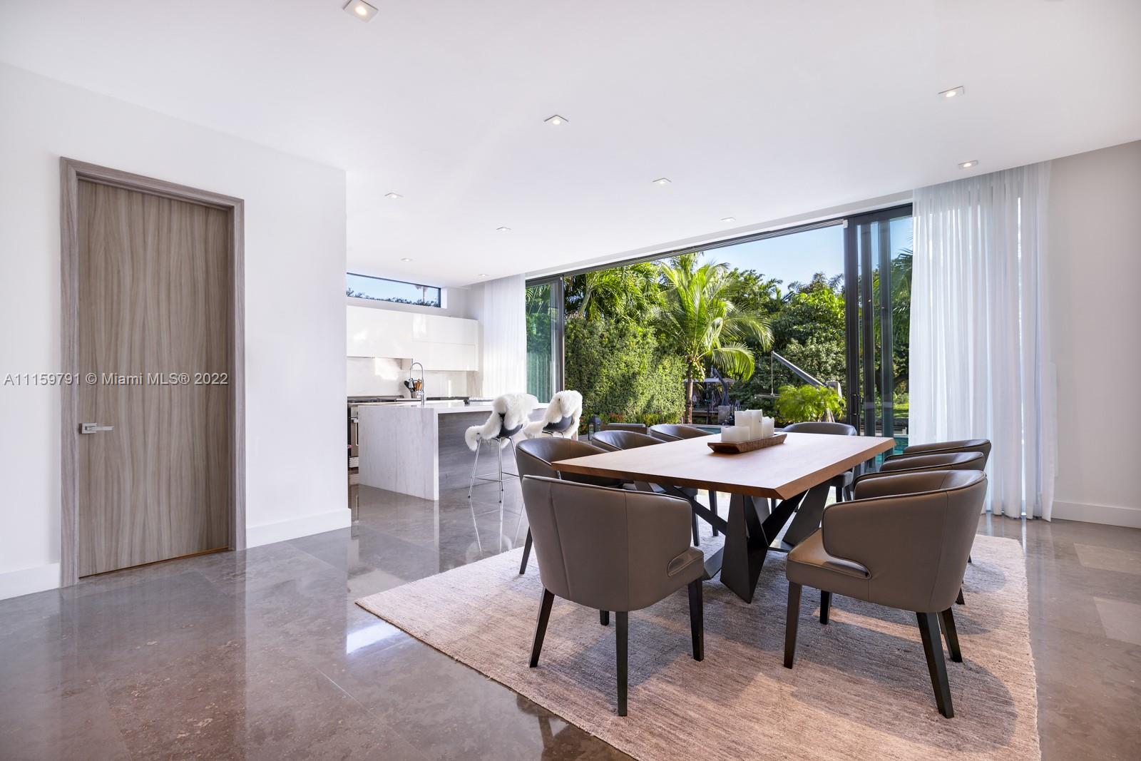 1540 Cleveland Road Miami Beach, FL 33141 - Photo 11 of 28 a view of a dining room with furniture window and outside view