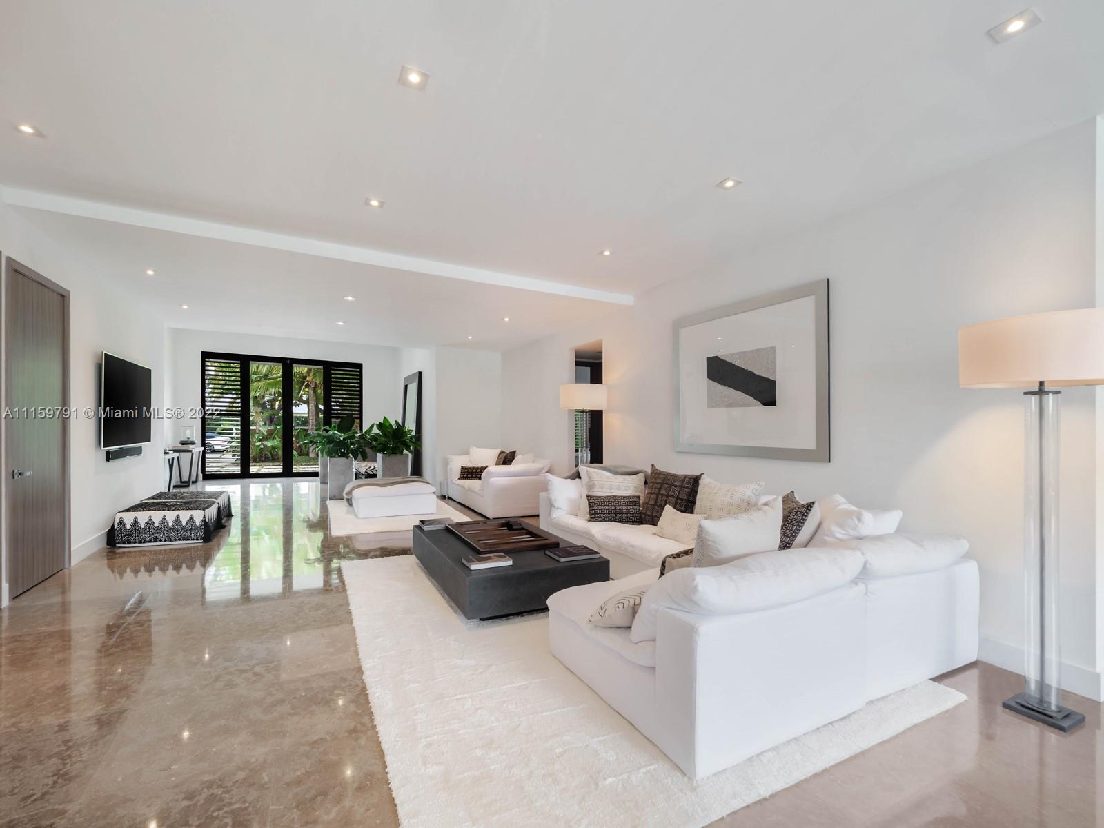 1540 Cleveland Road Miami Beach, FL 33141 - Photo 15 of 28 a living room with furniture and a table