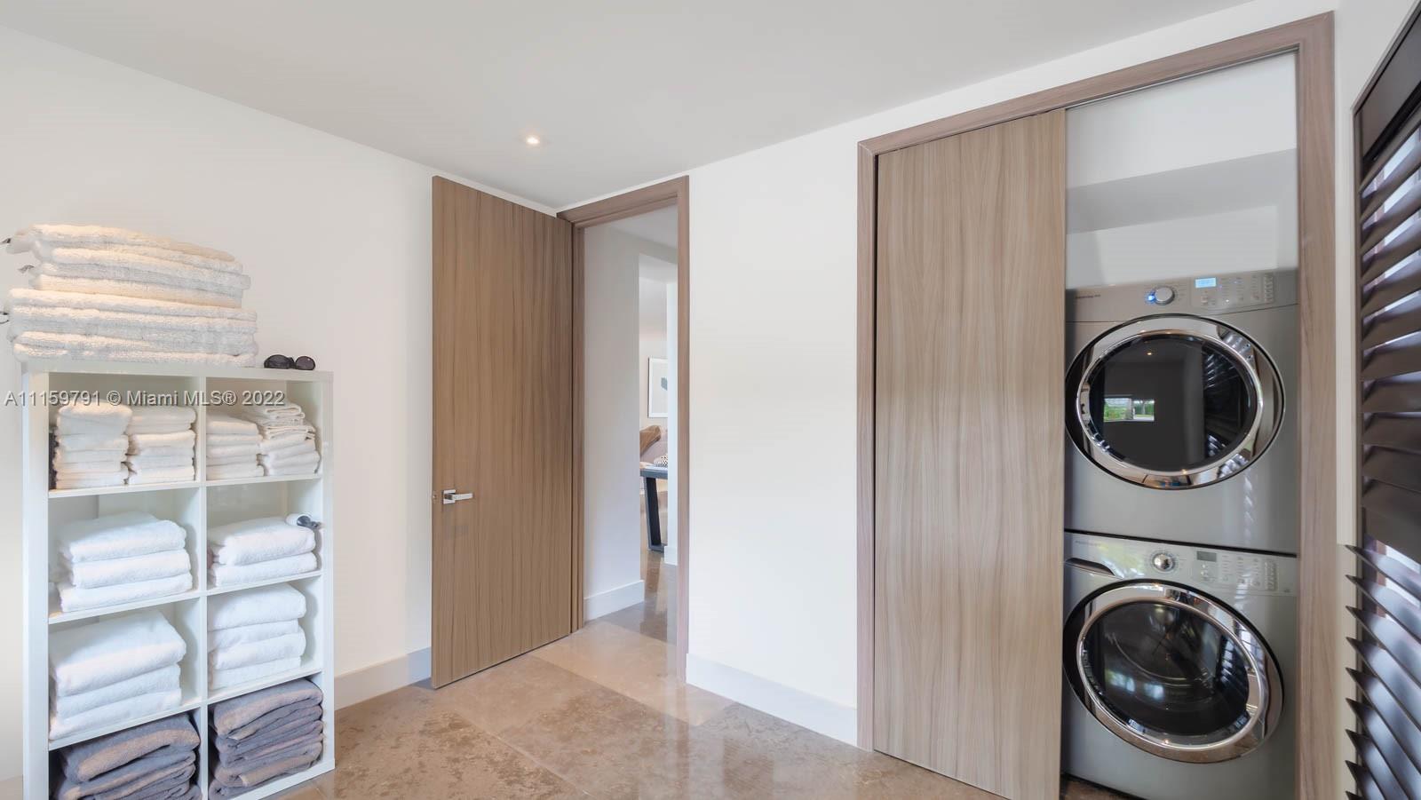 1540 Cleveland Road Miami Beach, FL 33141 - Photo 19 of 28 a view of a hallway with washer and dryer