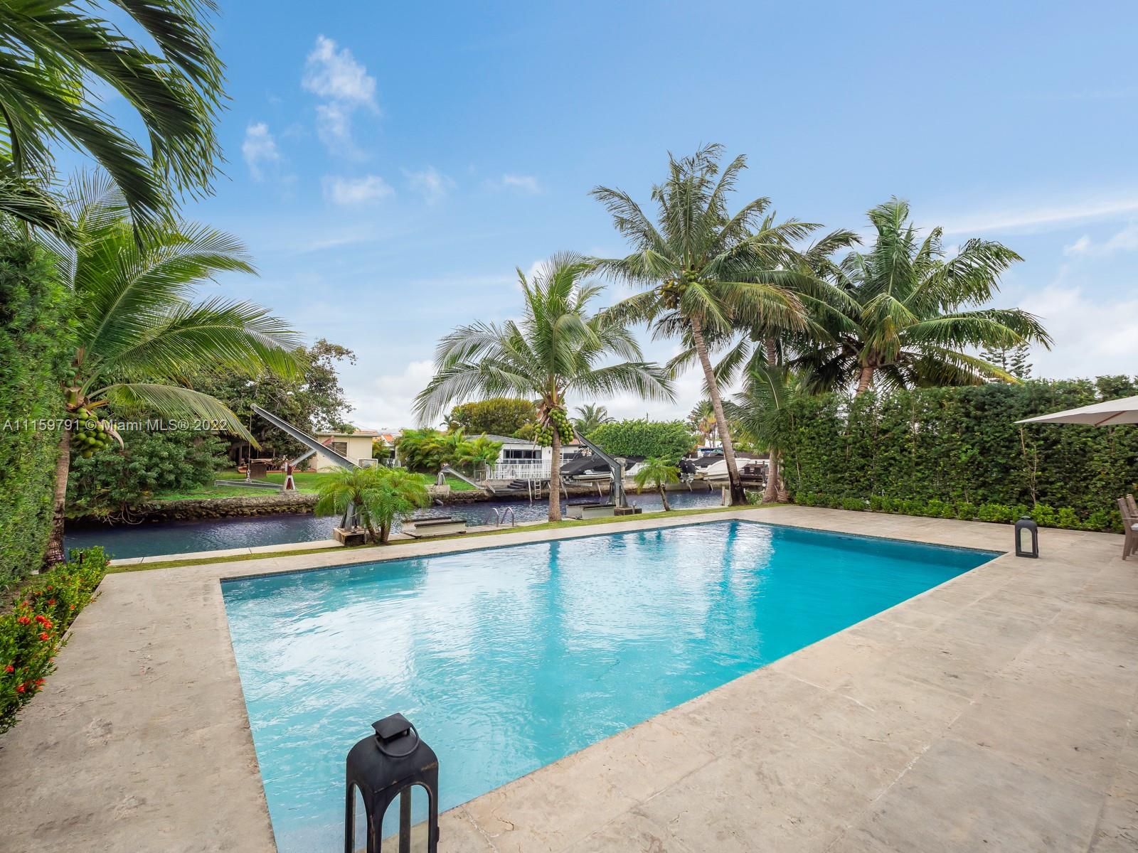 1540 Cleveland Road Miami Beach, FL 33141 - Photo 26 of 28 a view of a swimming pool and lounge chair