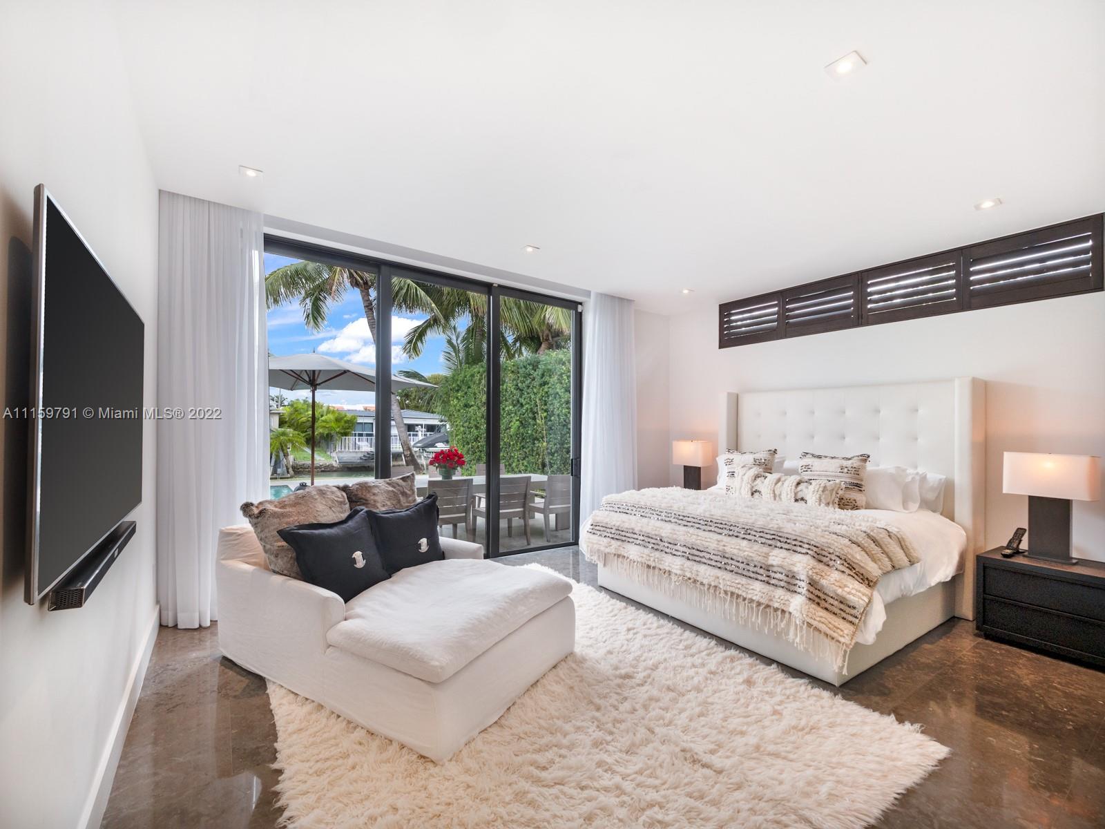 1540 Cleveland Road Miami Beach, FL 33141 - Photo 6 of 28 a bedroom with a bed and a large window