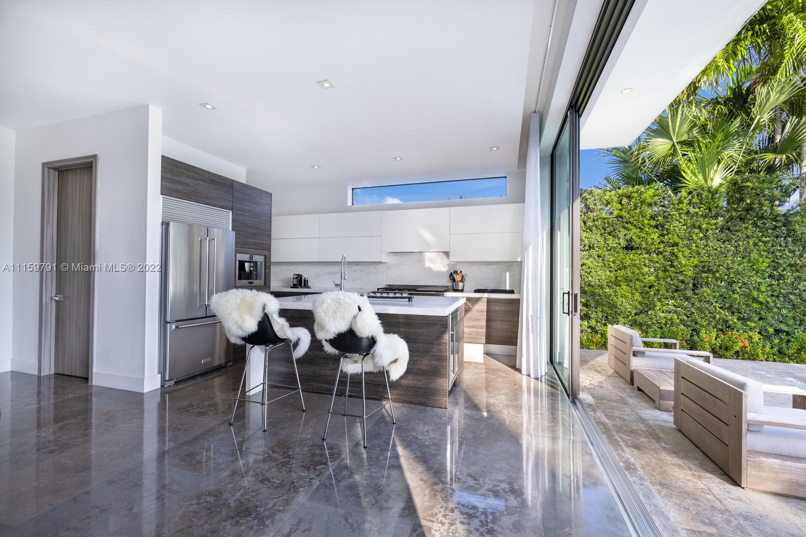 1540 Cleveland Road Miami Beach, FL 33141 - Photo 9 of 28 a view of a dining room with furniture window and wooden floor