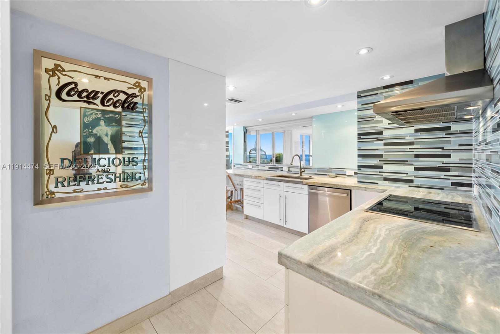 200 Ocean Ln Drive, Unit 501 Key Biscayne, FL 33149 - Photo 30 of 71 a kitchen with a sink and cabinets