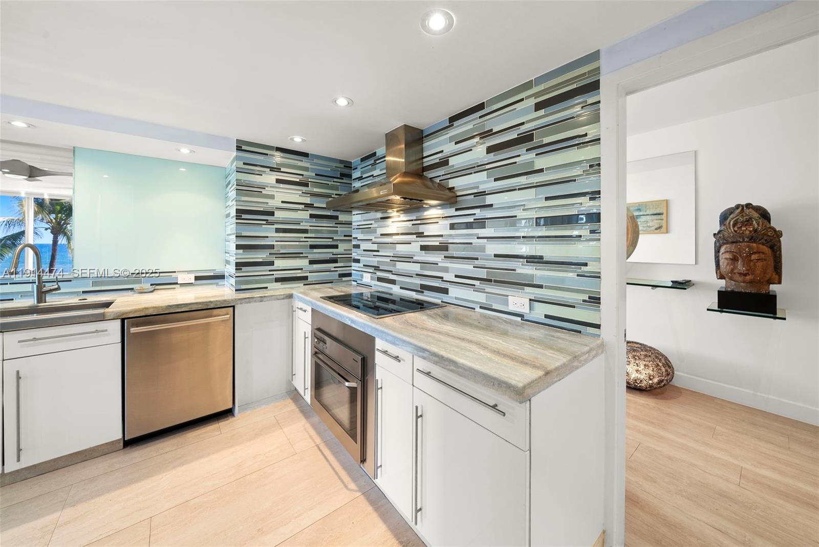 200 Ocean Ln Drive, Unit 501 Key Biscayne, FL 33149 - Photo 31 of 71 a kitchen with white cabinets and white appliances