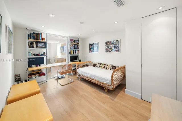 a dining room with furniture a chandelier and window