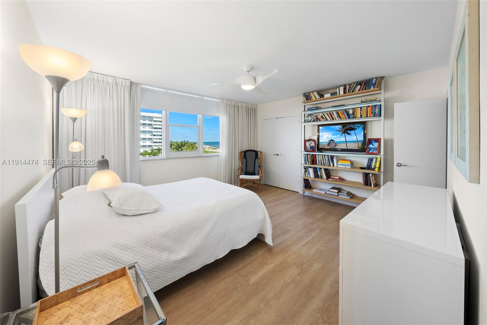 200 Ocean Ln Drive, Unit 501 Key Biscayne, FL 33149 - Photo 40 of 71 a bedroom with a bed and a cabinets