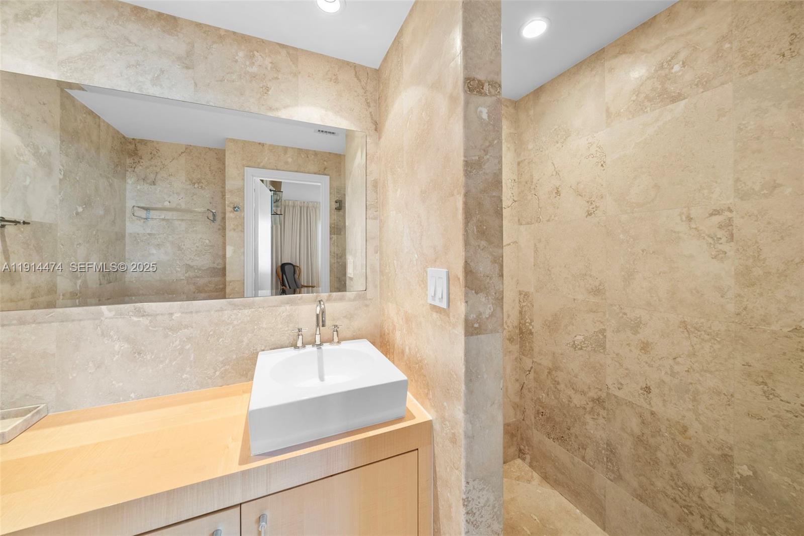 200 Ocean Ln Drive, Unit 501 Key Biscayne, FL 33149 - Photo 44 of 71 a bathroom with a sink and a mirror