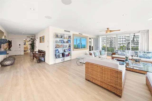 a bedroom with furniture and a potted plant