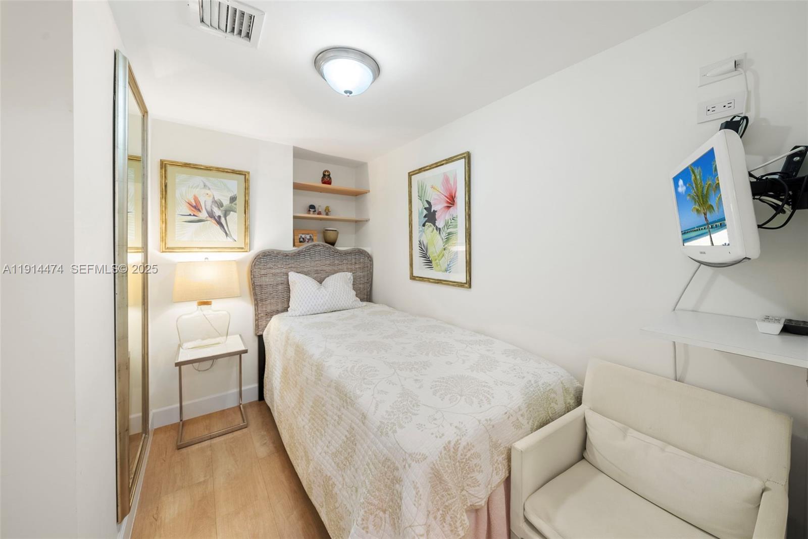 200 Ocean Ln Drive, Unit 501 Key Biscayne, FL 33149 - Photo 53 of 71 a bedroom with a bed and a couch