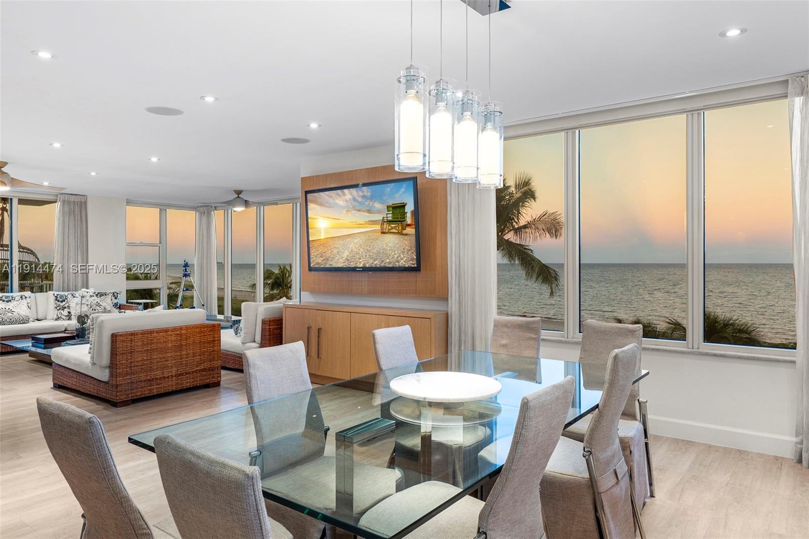 200 Ocean Ln Drive, Unit 501 Key Biscayne, FL 33149 - Photo 62 of 71 a dining room with furniture a chandelier and window