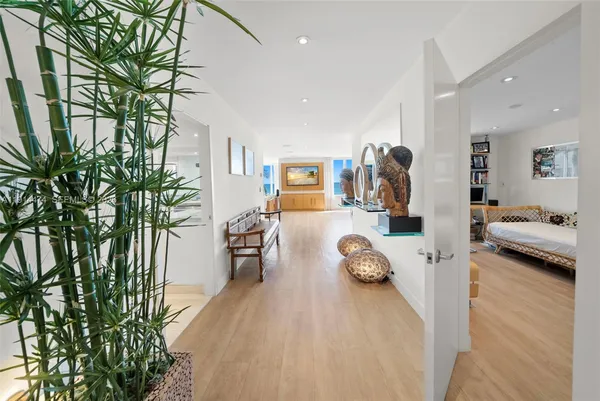 a living room with furniture and large window