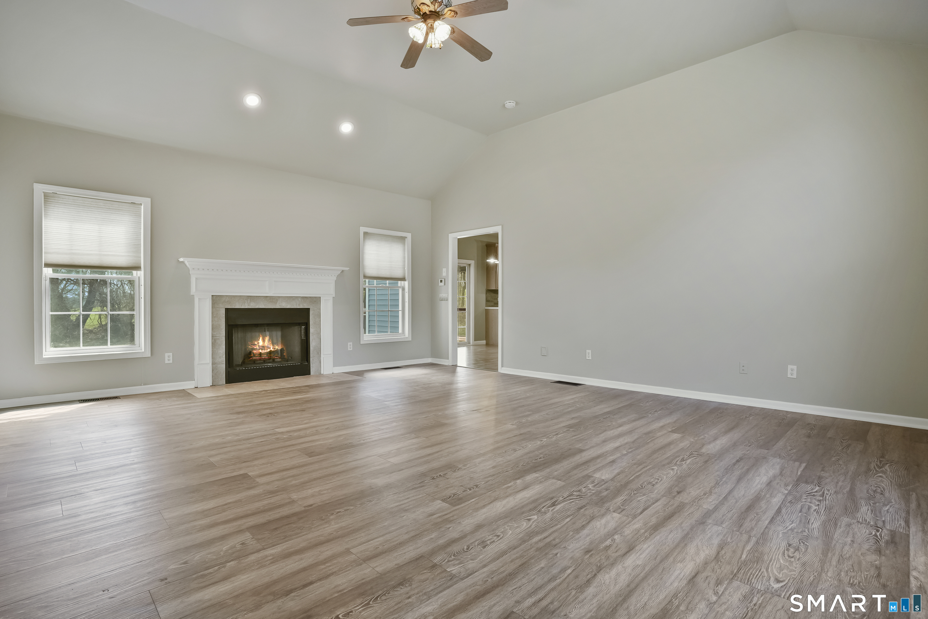 72 Perry Hill Road Shelton, CT 06484 - Photo 11 of 36 wooden floor fireplace and natural light in room