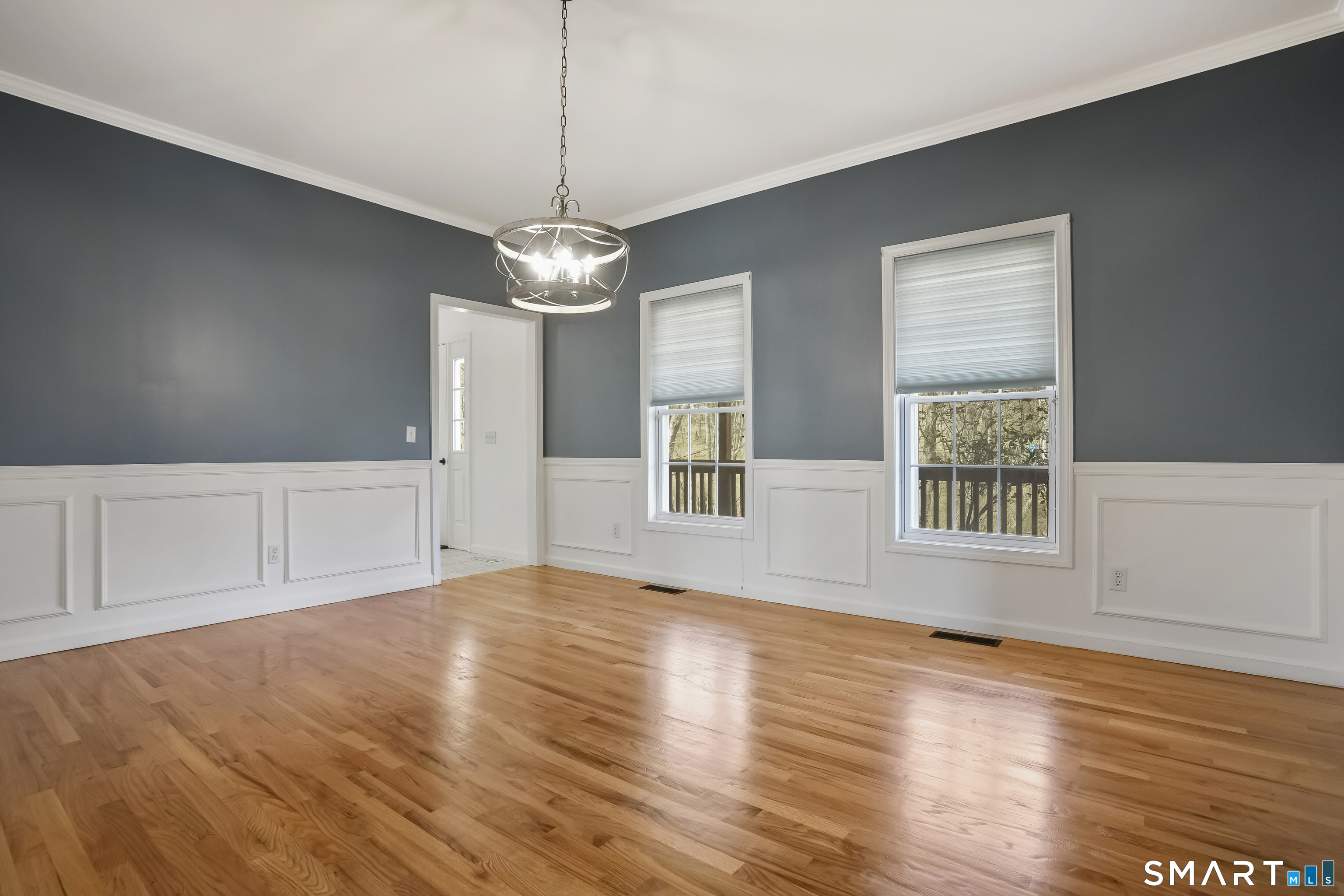 72 Perry Hill Road Shelton, CT 06484 - Photo 13 of 36 a view of an empty room with wooden floor and a window