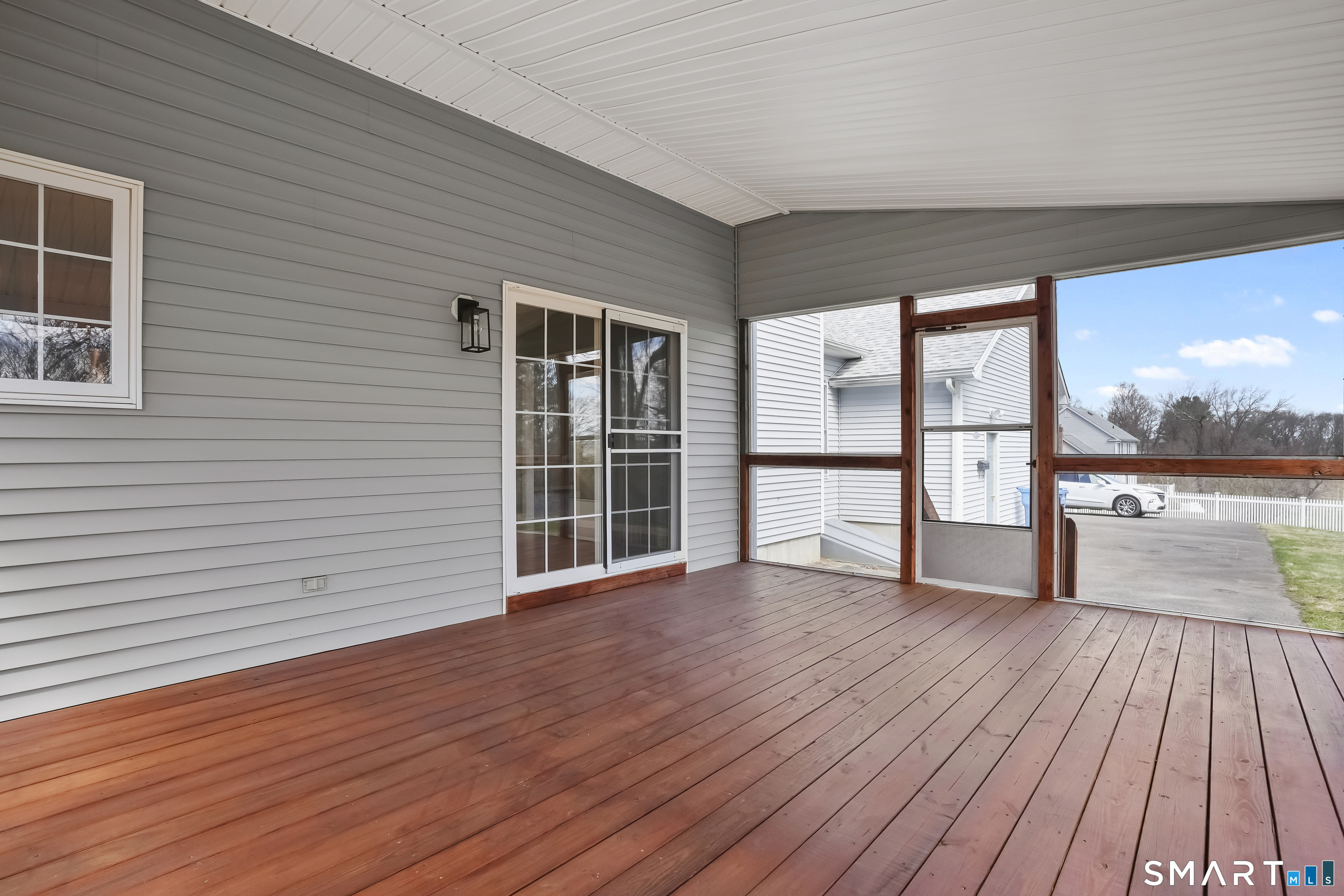 72 Perry Hill Road Shelton, CT 06484 - Photo 16 of 36 an empty room with wooden floor and windows