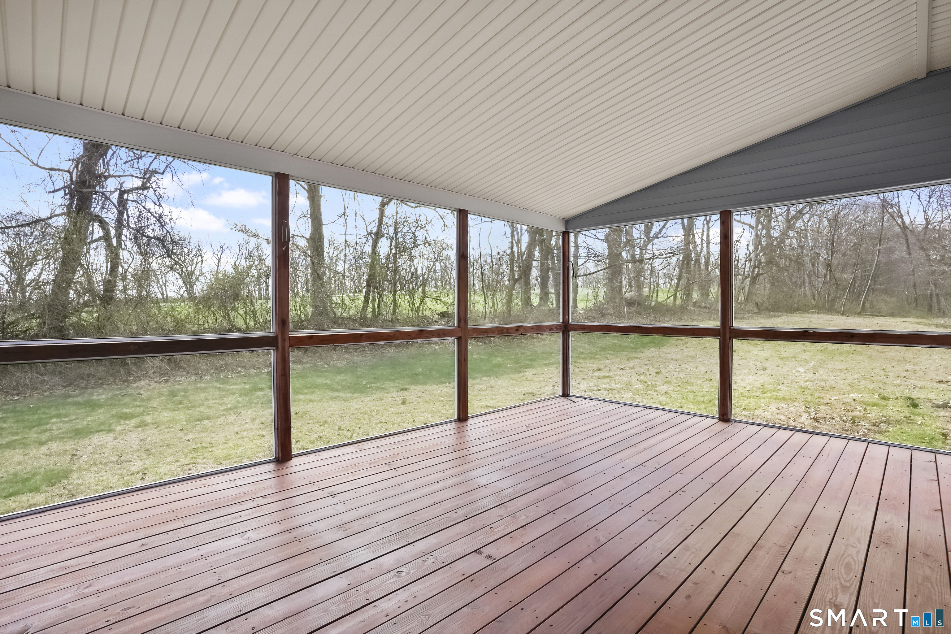 72 Perry Hill Road Shelton, CT 06484 - Photo 17 of 36 a view of empty room with wooden floor and floor to ceiling window